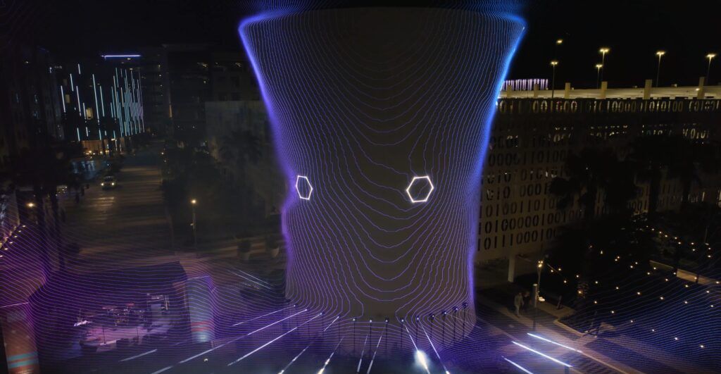 Aerial view. blue and purple laser vortex projected onto the Beacon at Lake Nona Town Center