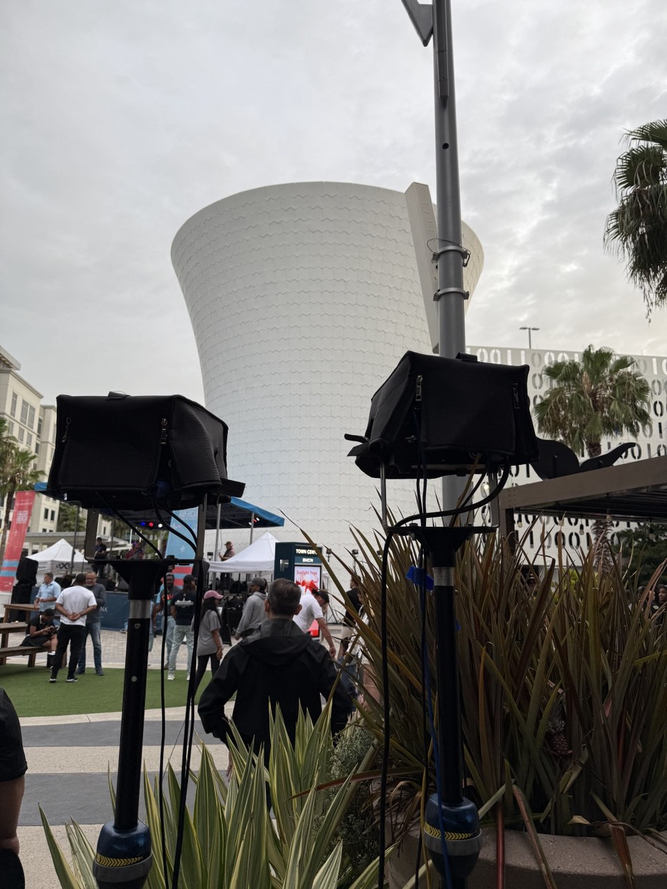 Laser projectors on tripods with the Beacon water tower in the background. daytime setup
