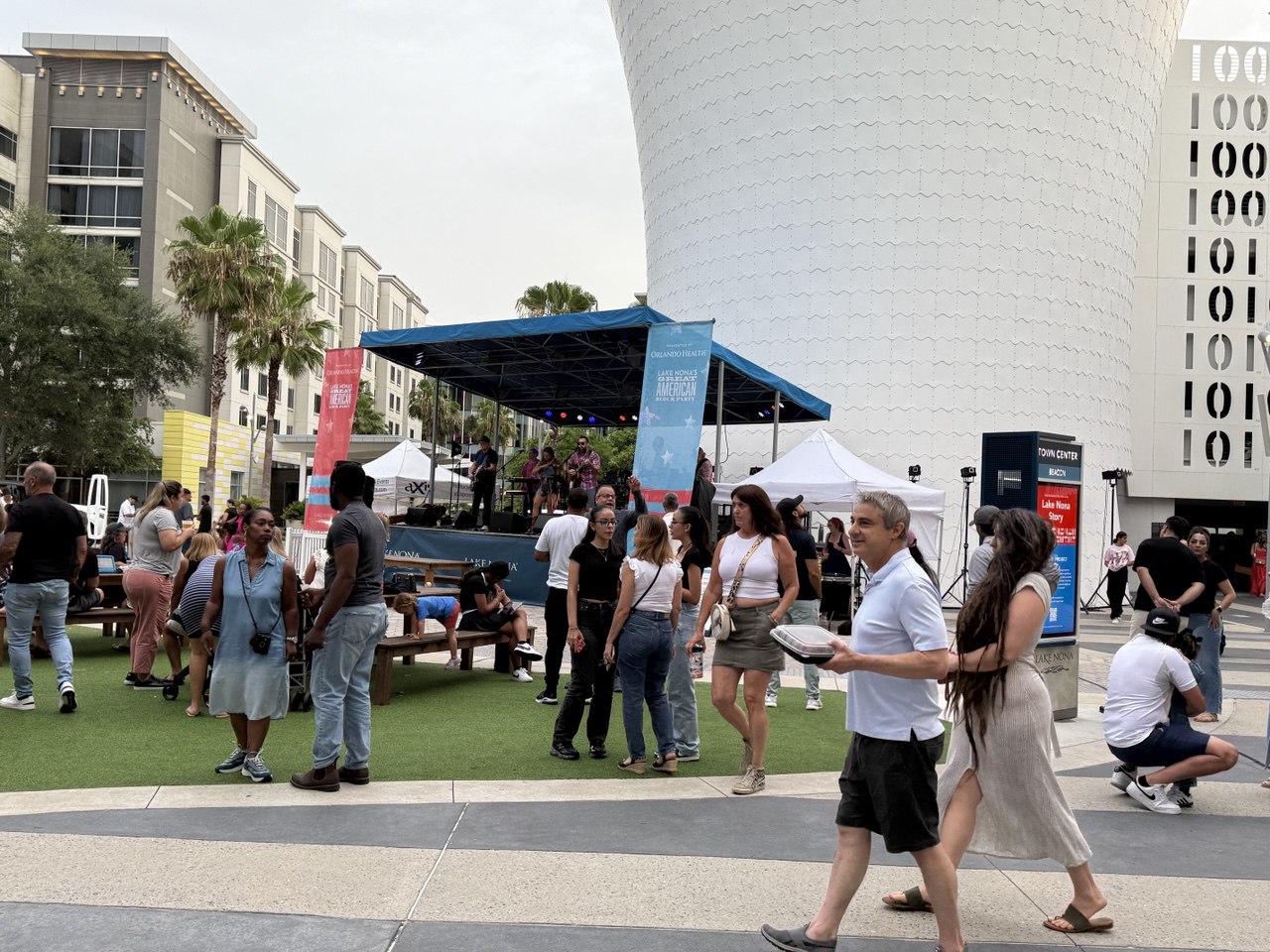 Lake Nona Town Center. daytime crowd with live entertainment and food vendors