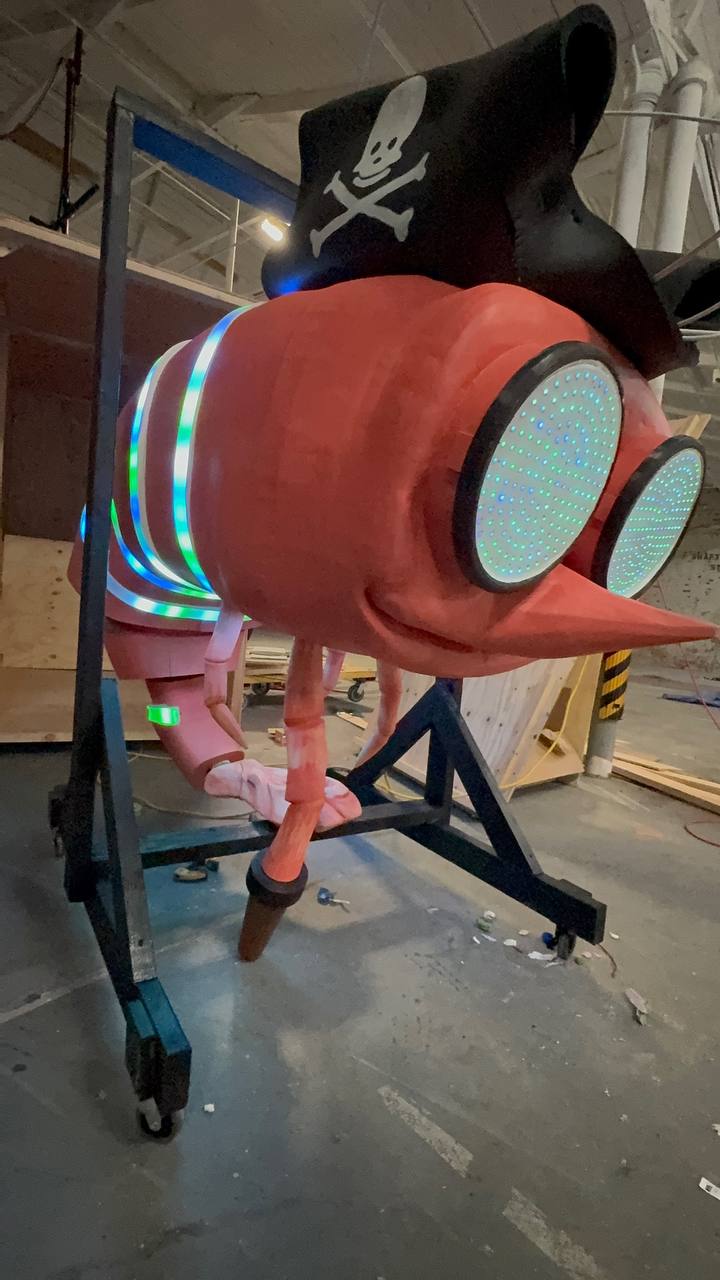 Shrimpy lit up in the workshop, LEDs glowing