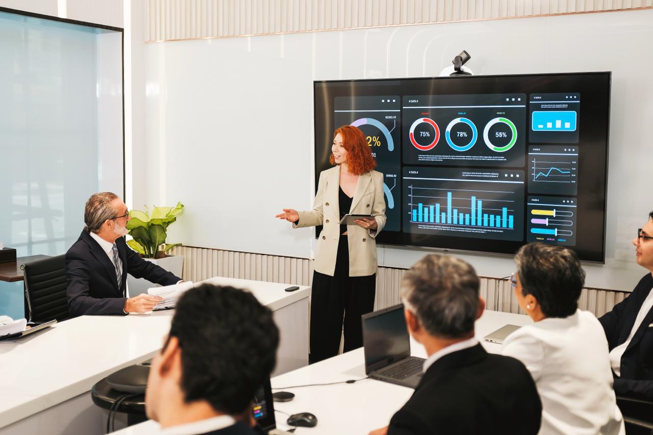 Executive boardroom with dual displays, video conferencing, and integrated AV system