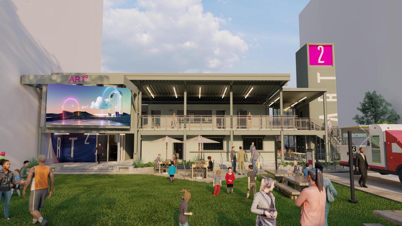 Art² Art Park front rendering with LED video wall and crowd