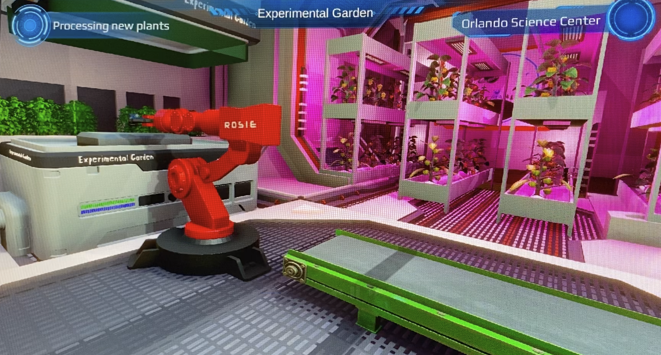 Rosie the robot tending plants in the Experimental Garden — LED video wall at Orlando Science Center